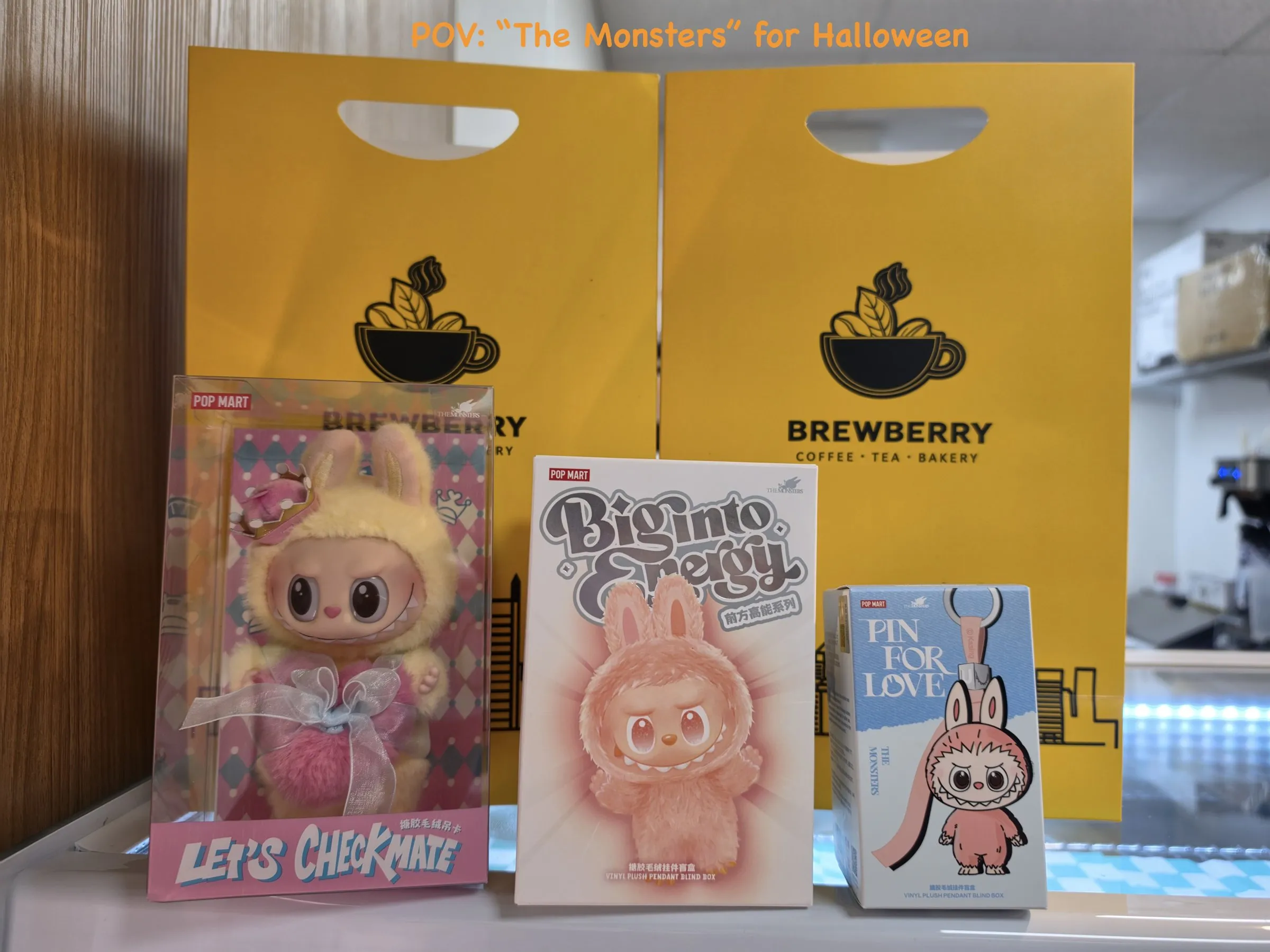 The three Labubu prizes displayed in front of Brewberry Pittsburgh shopping bags